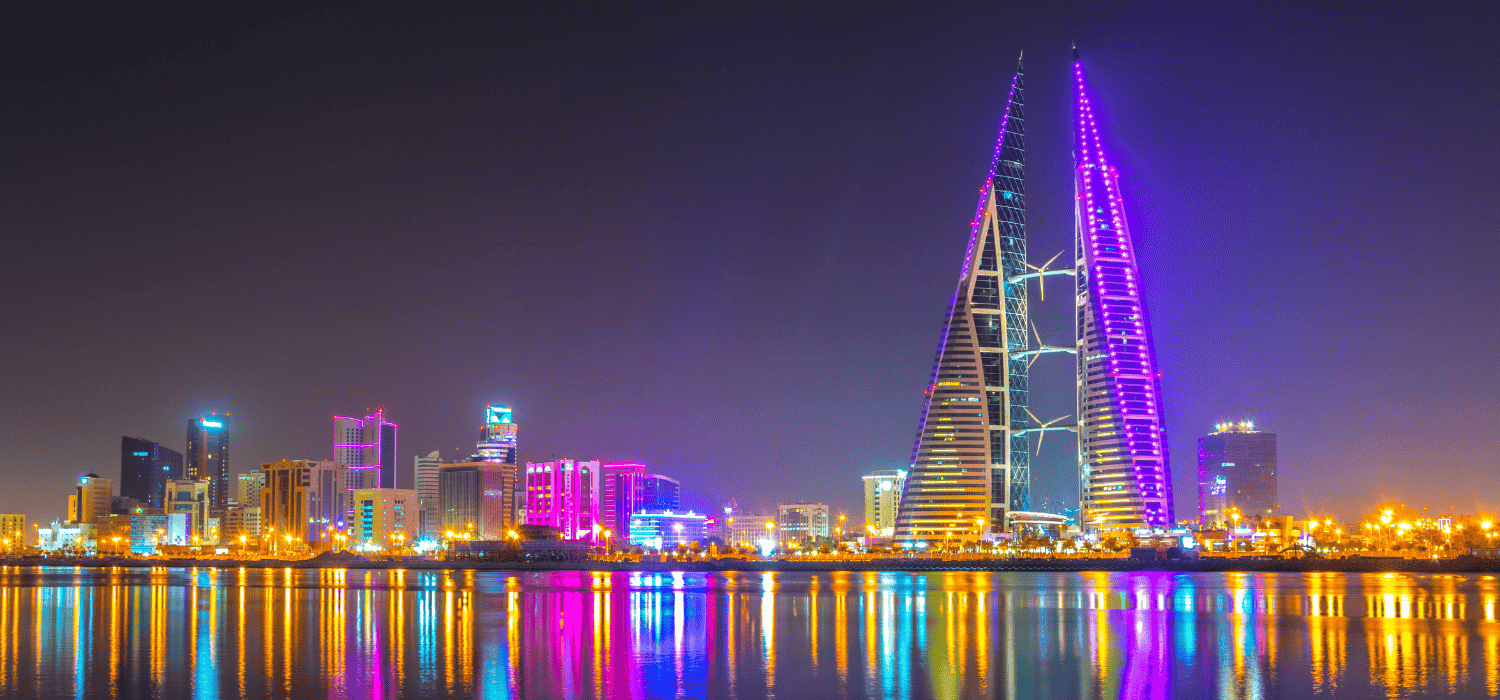 Skyline of Manama dominated by the World trade Center building during night, Bahrain.