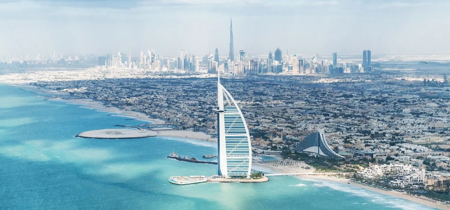 The bustling coastline of Dubai with corporate business towers on the skyline