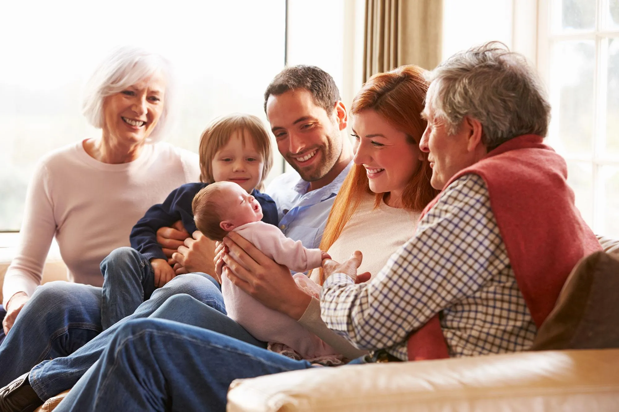 Family sitting together with new baby