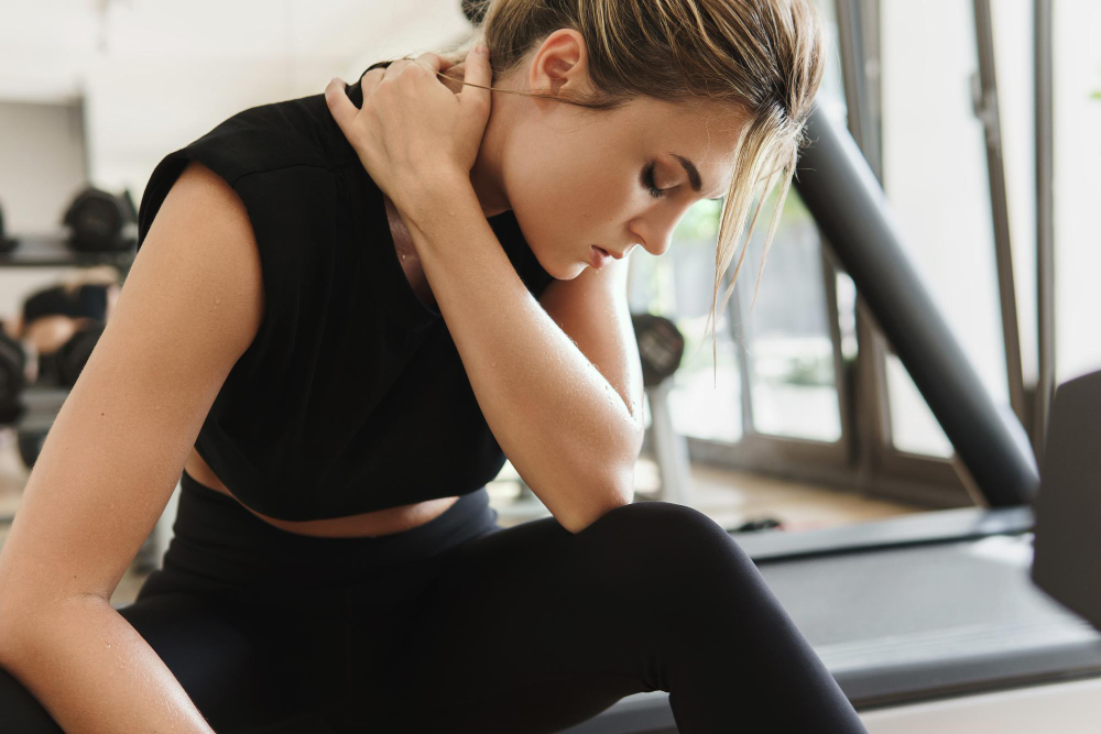 Doctor of Physical Therapy conducting comprehensive evaluation with patient at Urban PT fitness facility in Ithaca