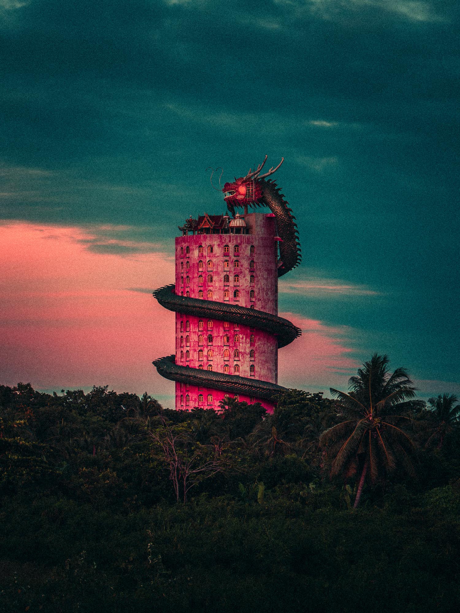Tall cylindrical building with a large dragon sculpture spiraling around it at dusk, surrounded by trees.