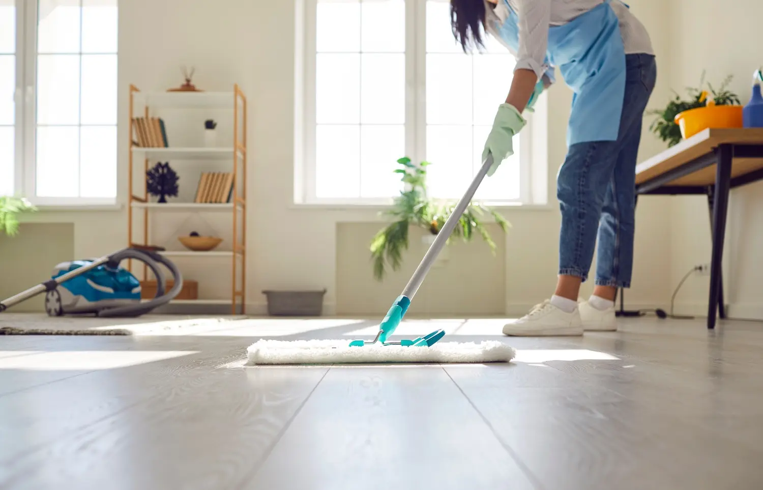 Lady cleaning the floor with a mop