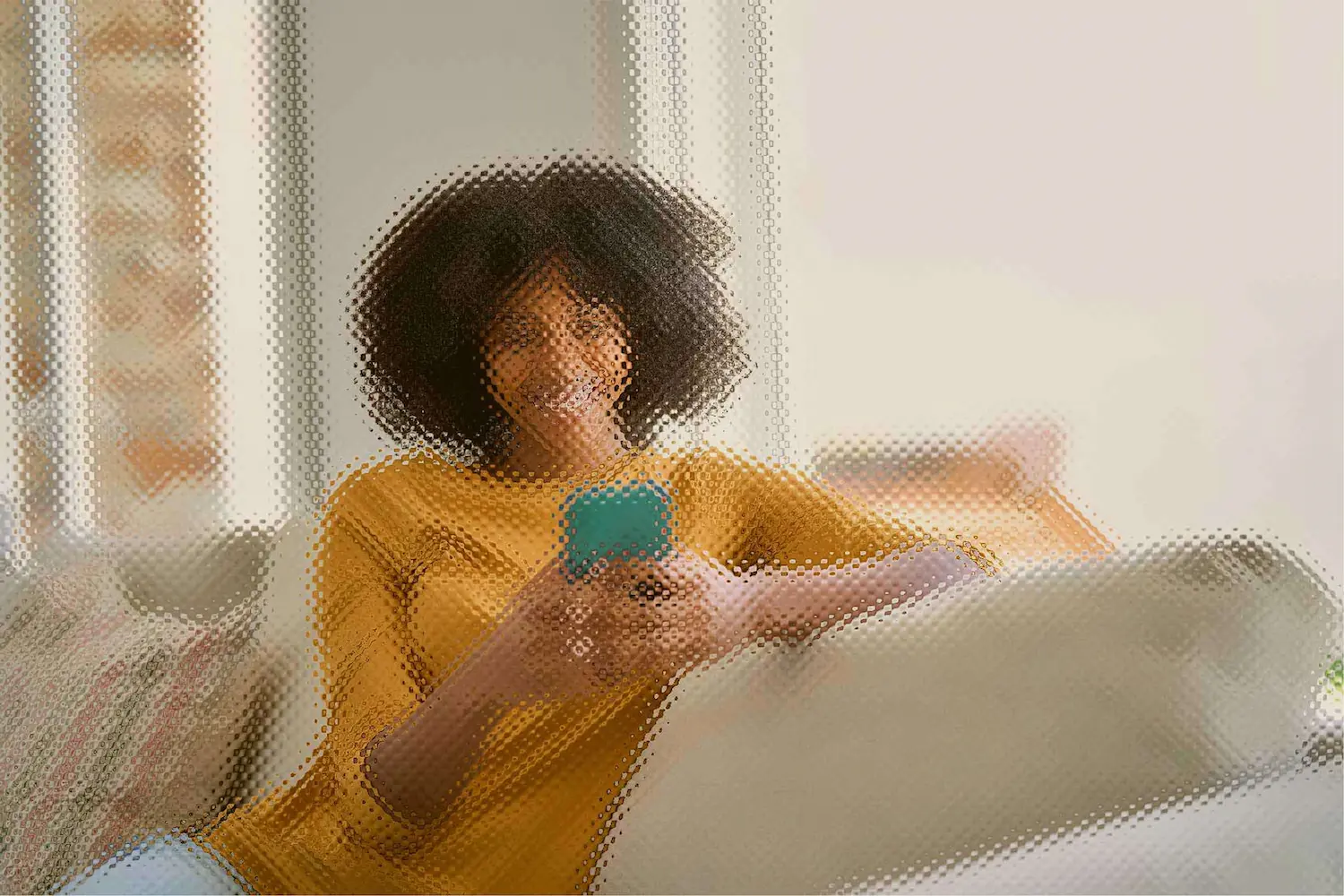 Lady using her phone on the couch