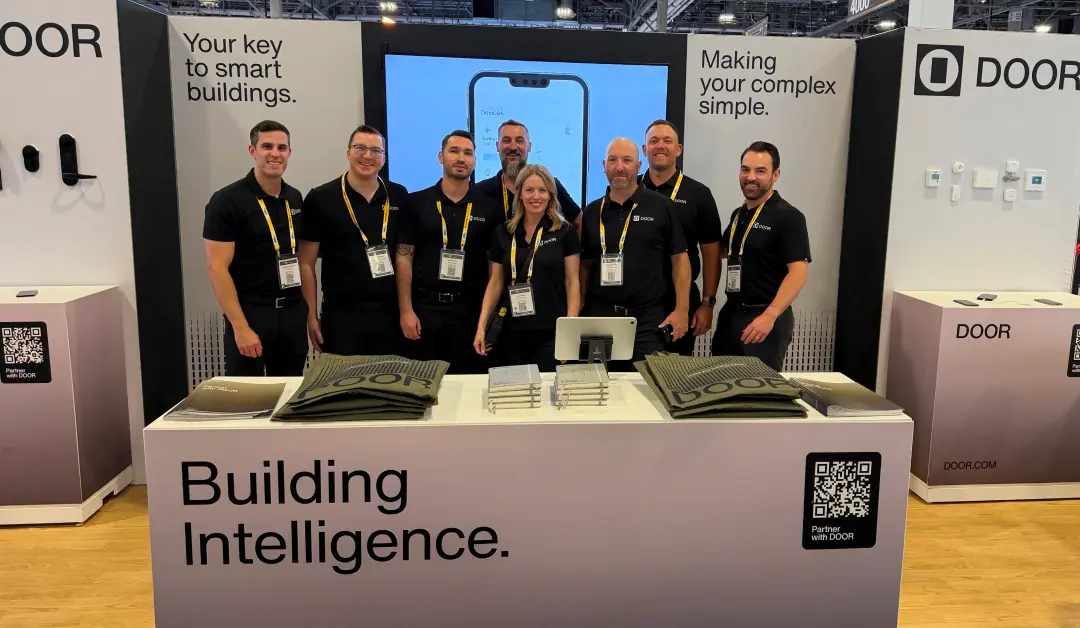 DOOR team at ISC West exhibiting smart building technology, access control systems, and building intelligence for multifamily properties