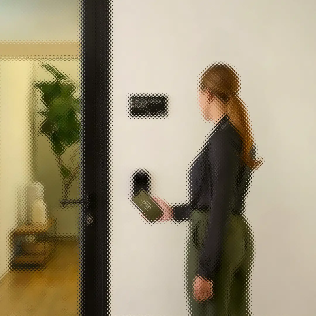 Woman using smartphone to unlock apartment door with smart lock and access control system