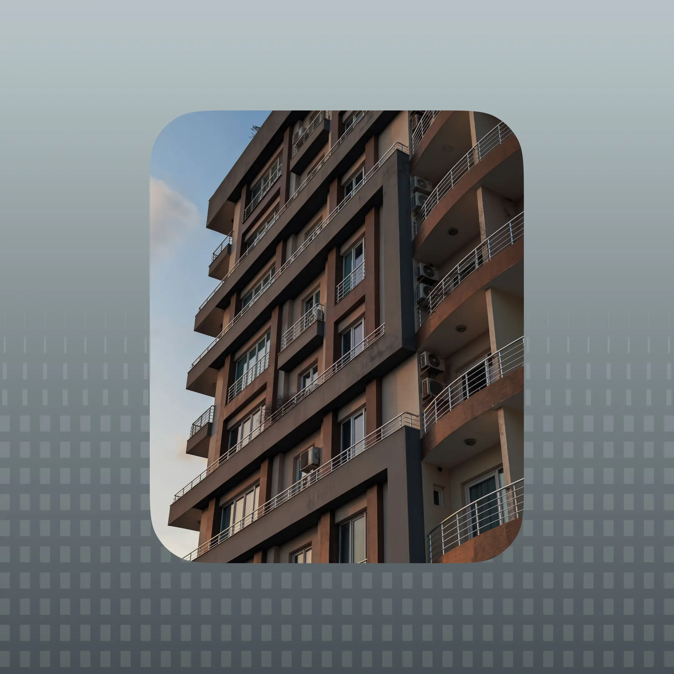 Modern multifamily apartment building exterior with balconies and residential units
