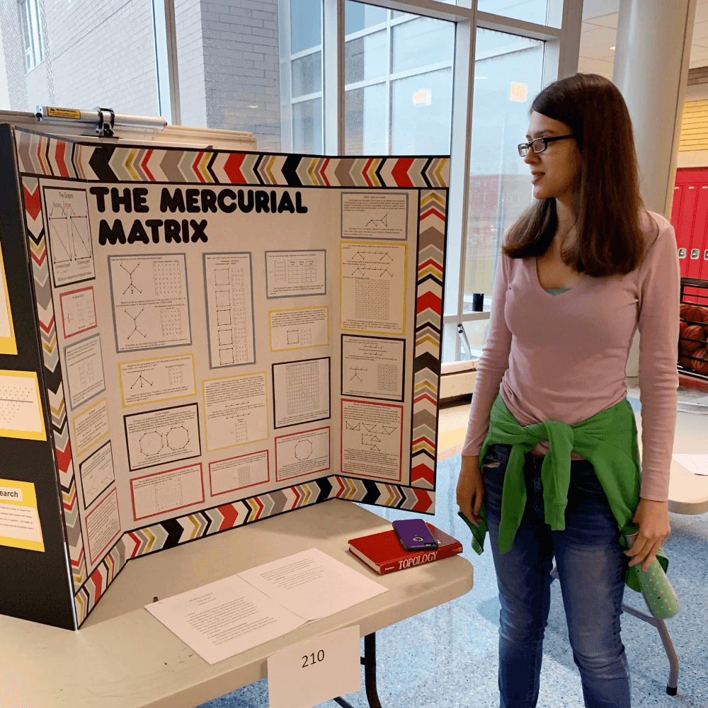 Student present work at a math symposium