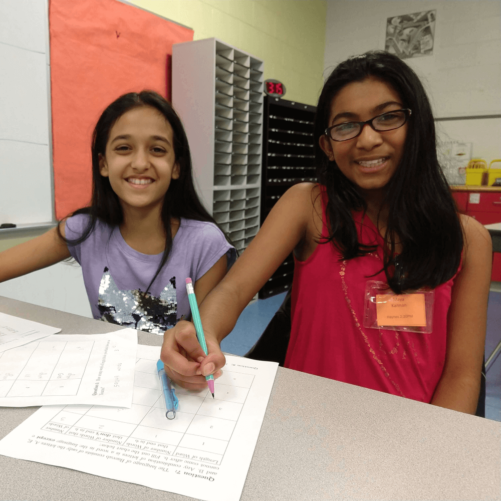 Two female students enjoying a math circle