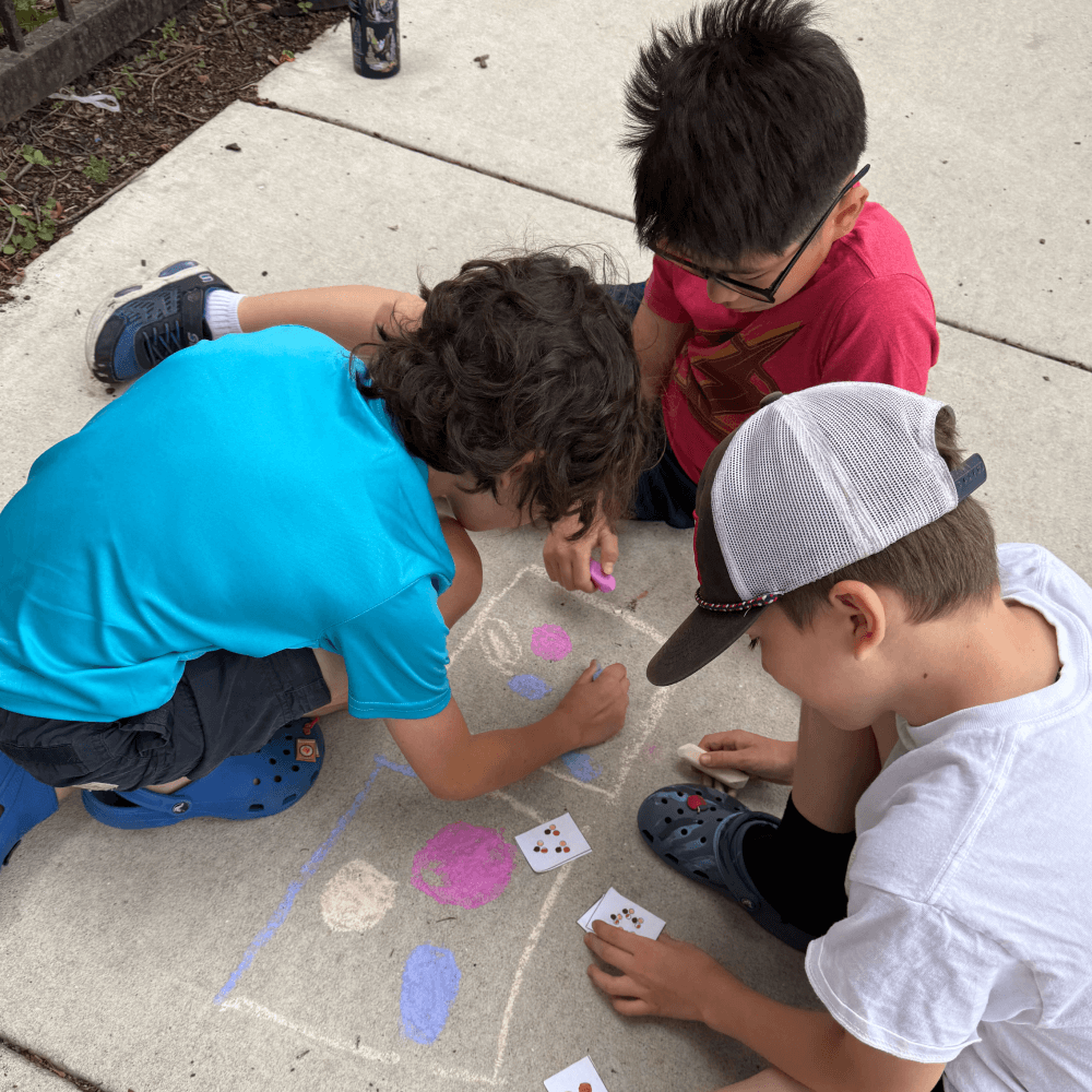 Children doing math activities outdoors