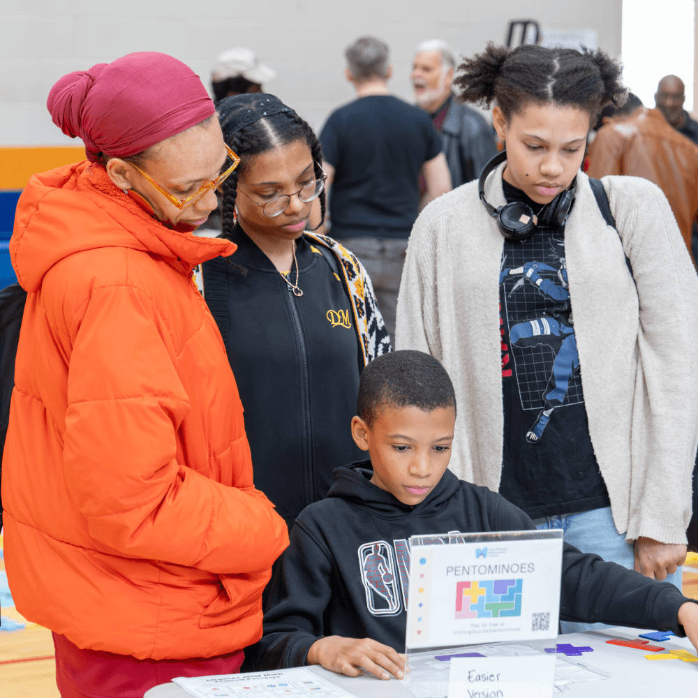 Children doing math at a Math Circles of Chicago math festival