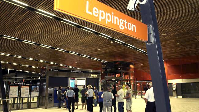 Vibrant scene at Leppington Station with a modern train and people, 9 minutes from Gurner Grove in Austral, NSW