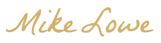Stylized signature of Mike Lowe in gold script on a transparent background.