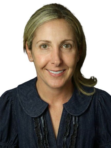Smiling woman with blonde hair wearing a dark blue blouse with a ruffled collar.