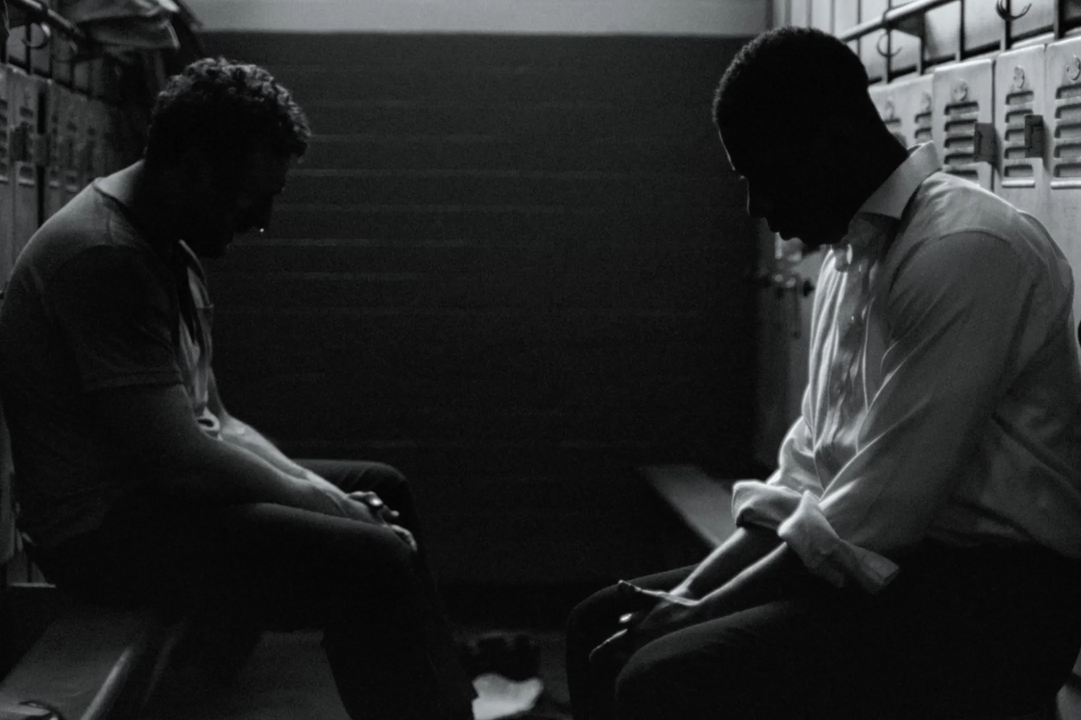 A couple of men sitting next to each other.