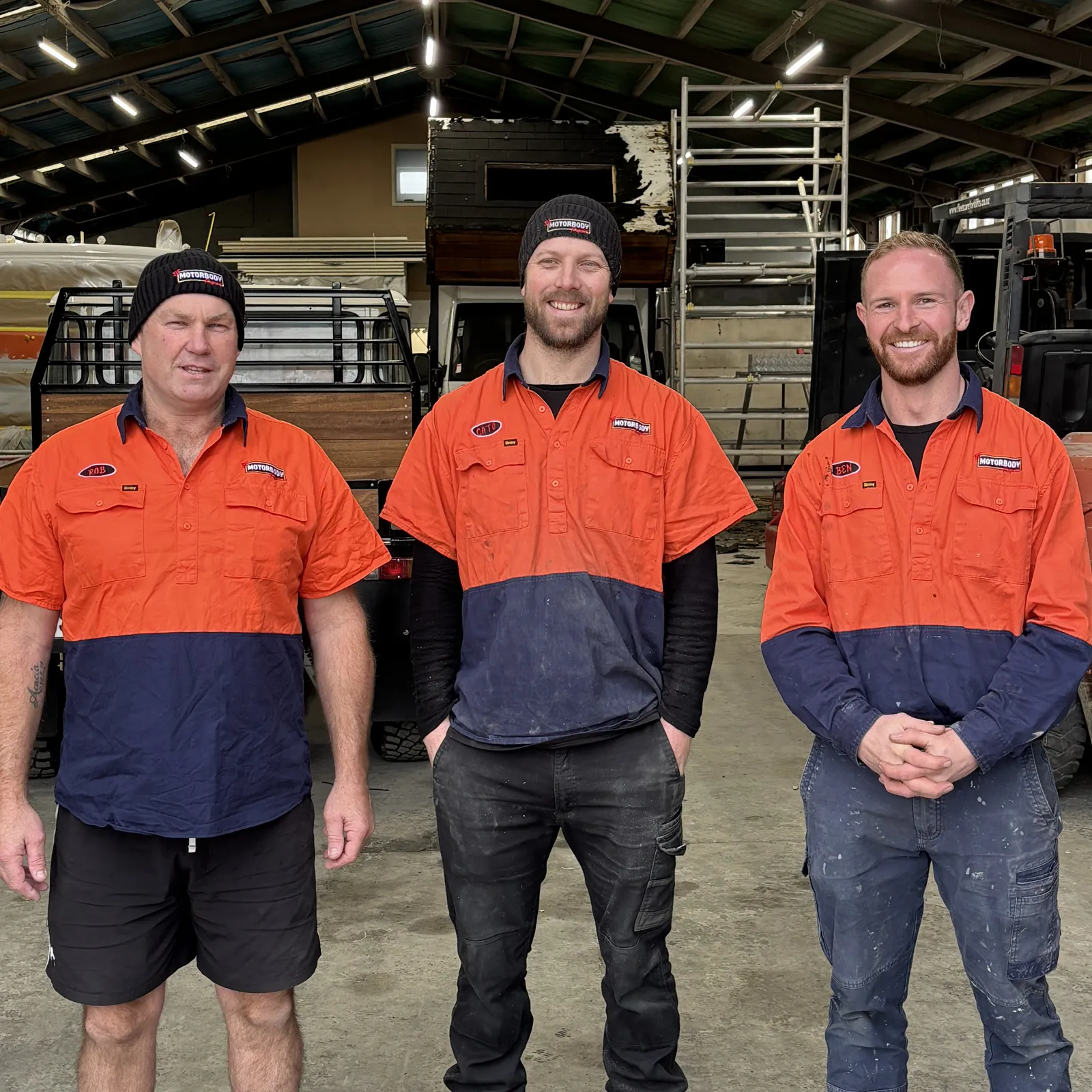 The BF Motorbody team standing together in their work garage. From left to right there's Rob, Cato and Ben.