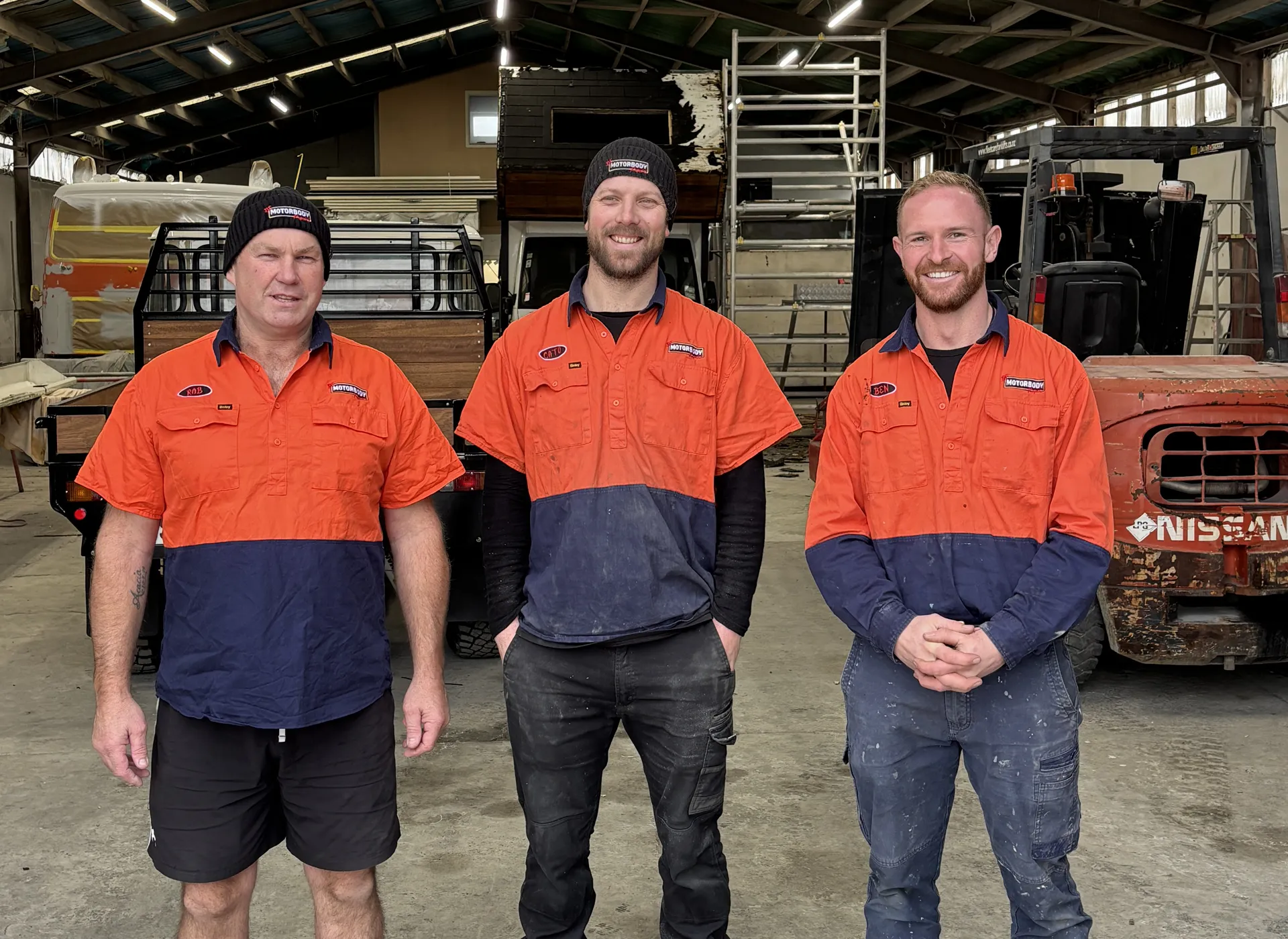 The BF Motorbody team standing together in their work garage. From left to right there's Rob, Cato and Ben.