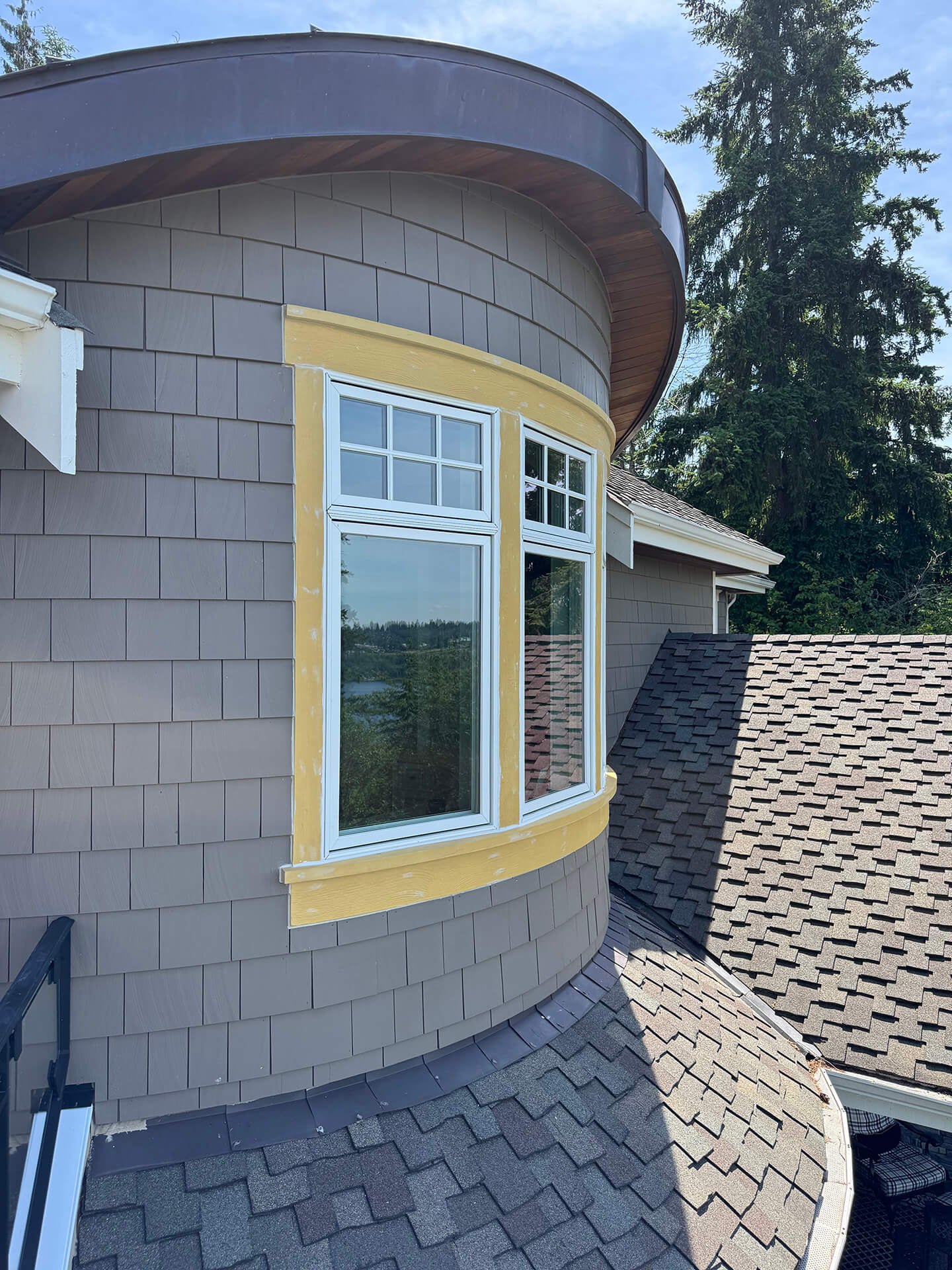 New replacement window set in a curved exterior wall during a Cascade View Construction project