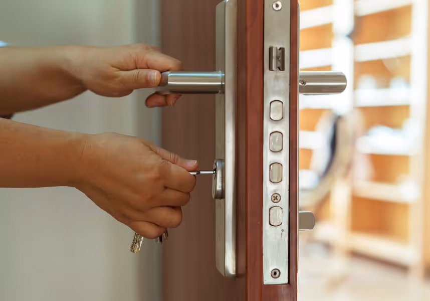 person unlocking a door