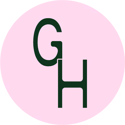 Custom monogram logo with a green sans-serif font on top of a pale pink circle.