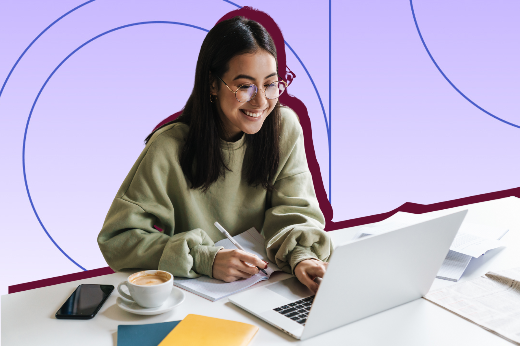 Woman in glasses smiling while working on laptop and notes.