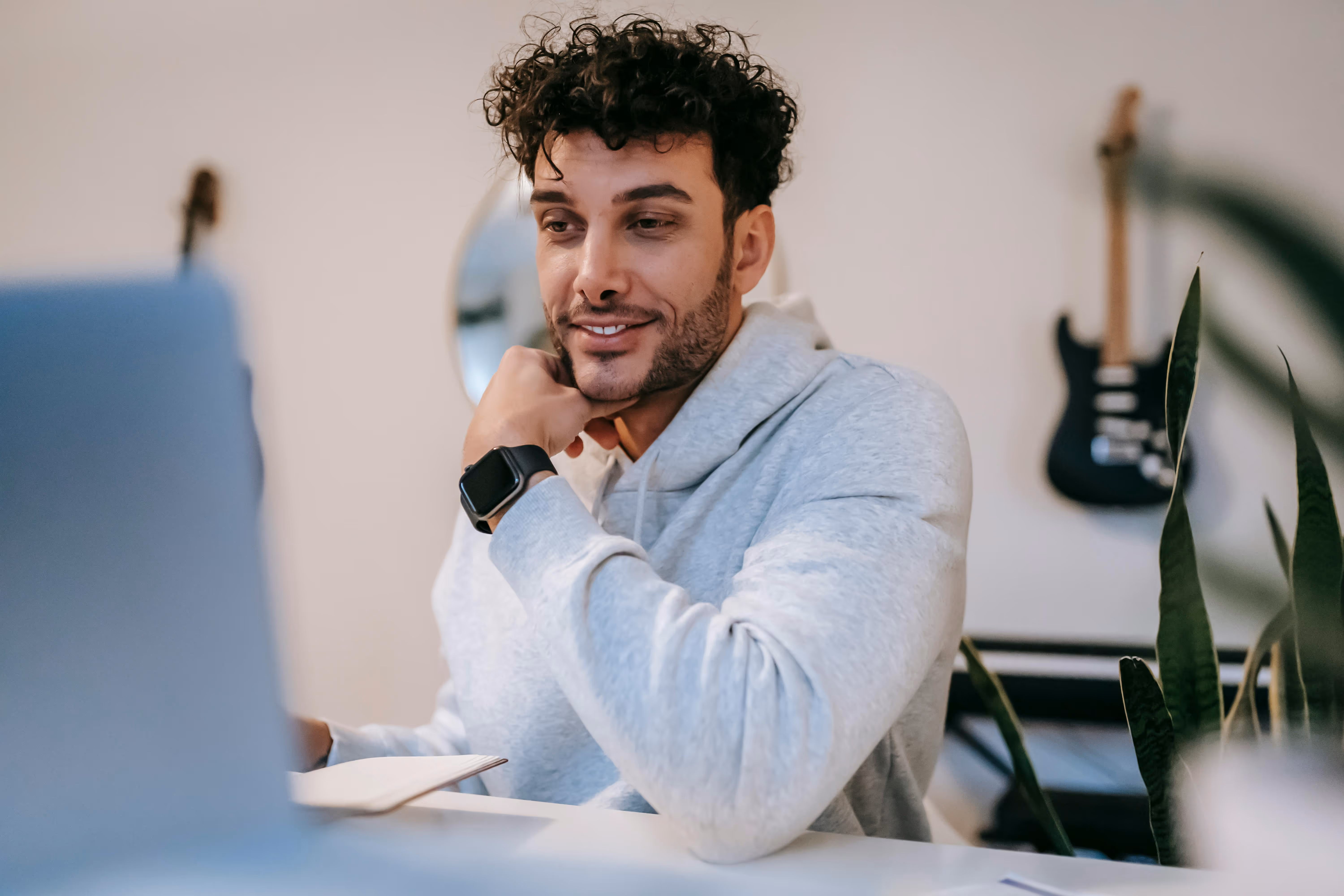 a man calling on a laptop