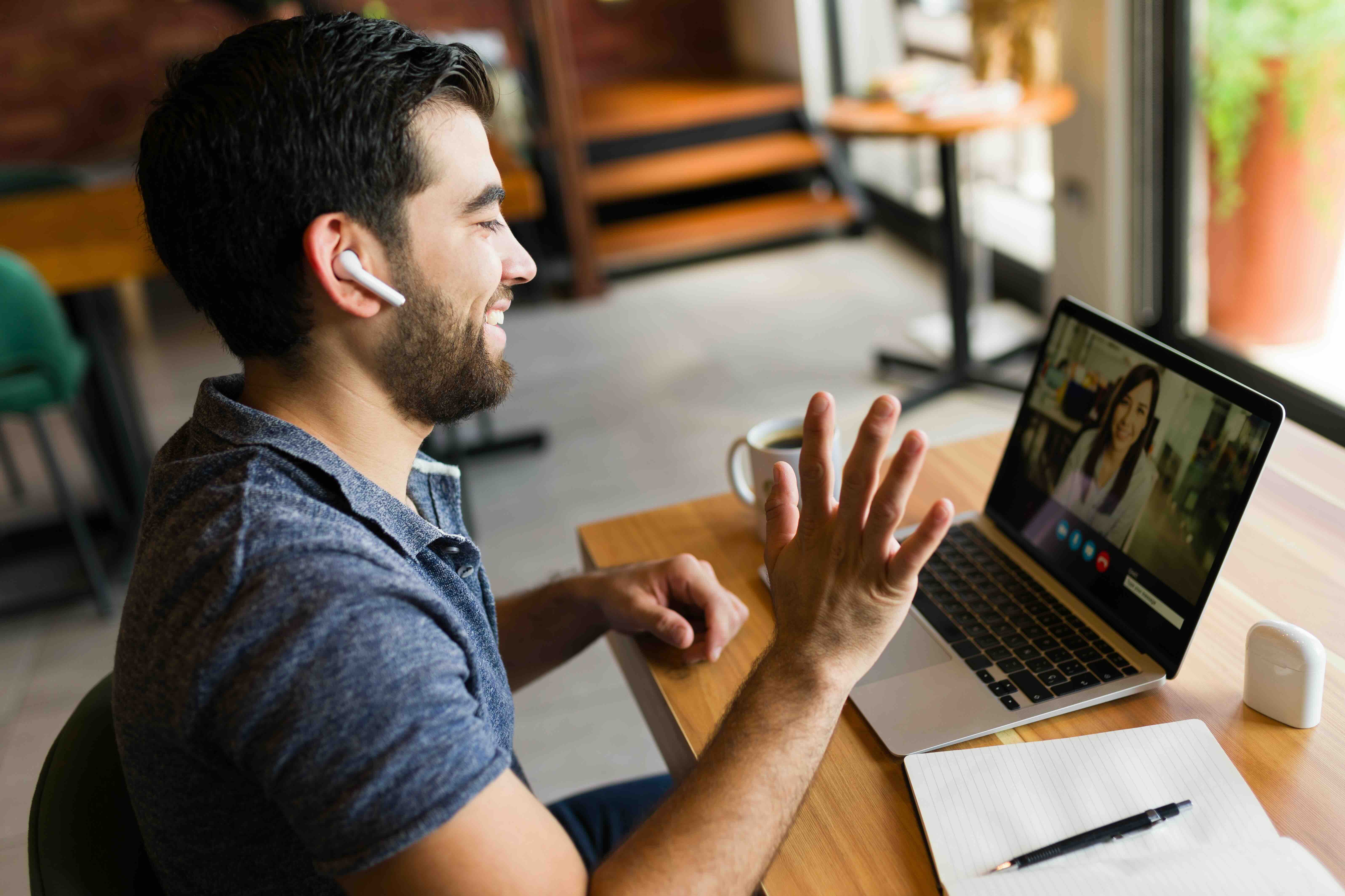 A person calling on a laptop