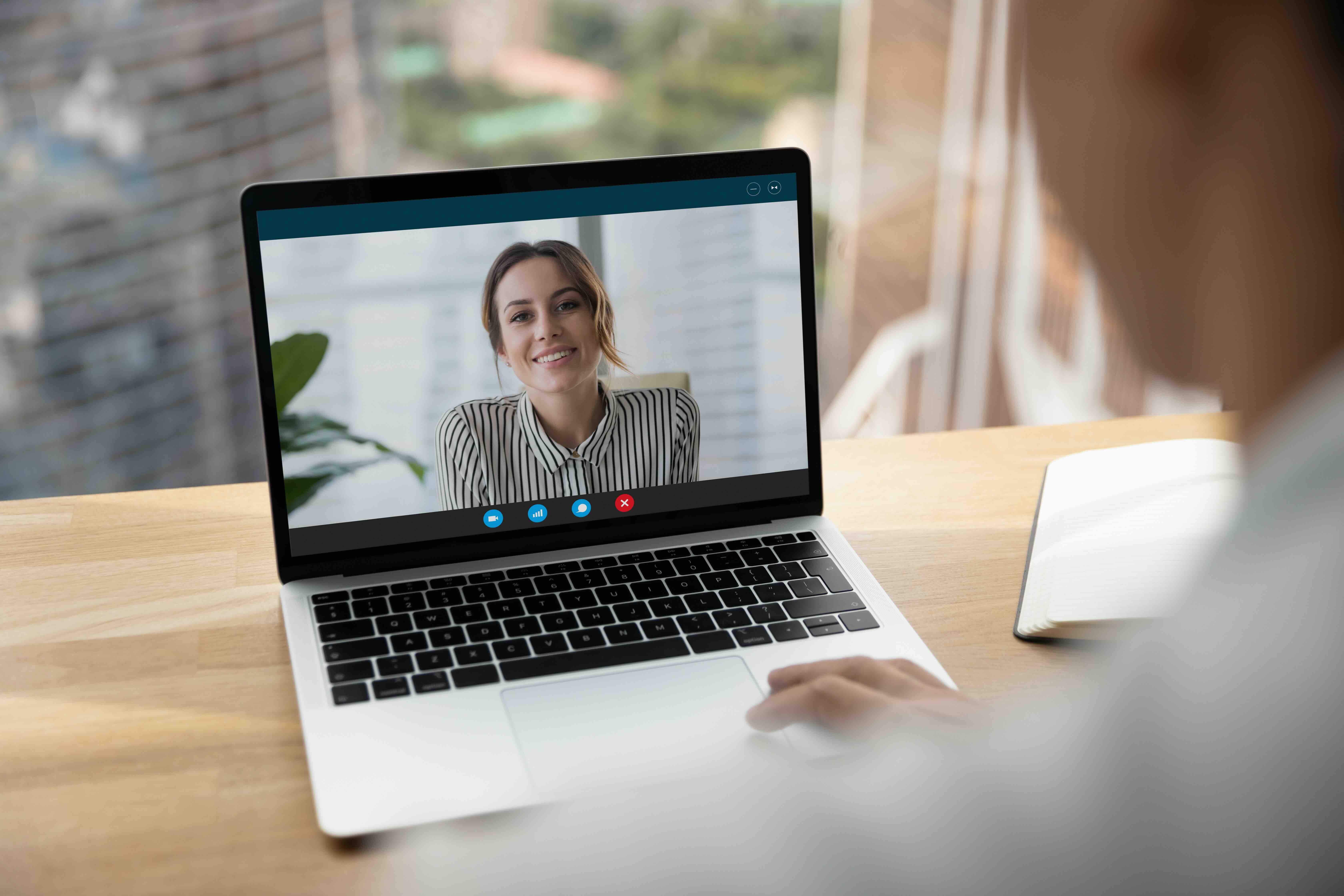 A person calling on a laptop