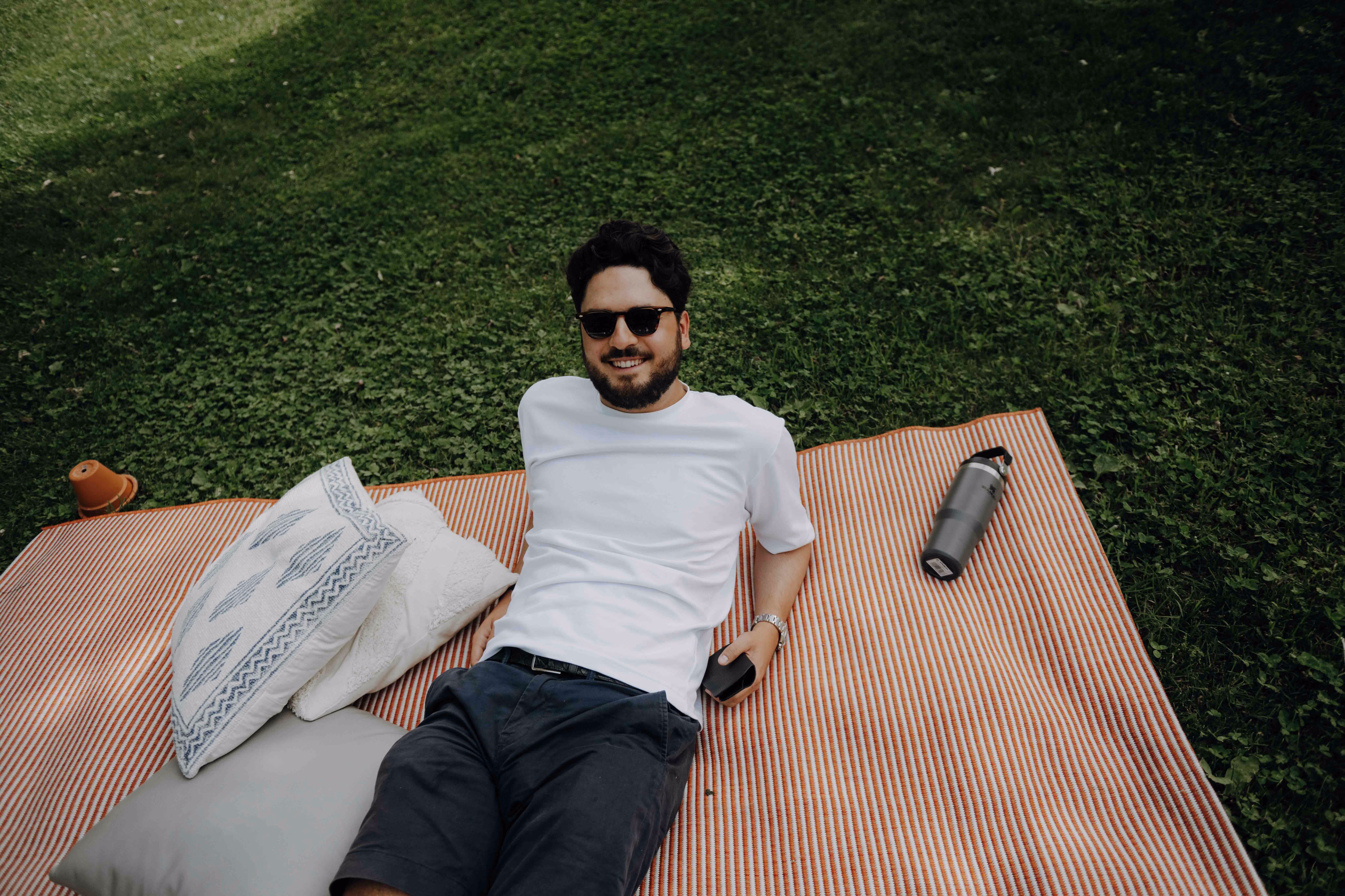a man laying down on a blanket