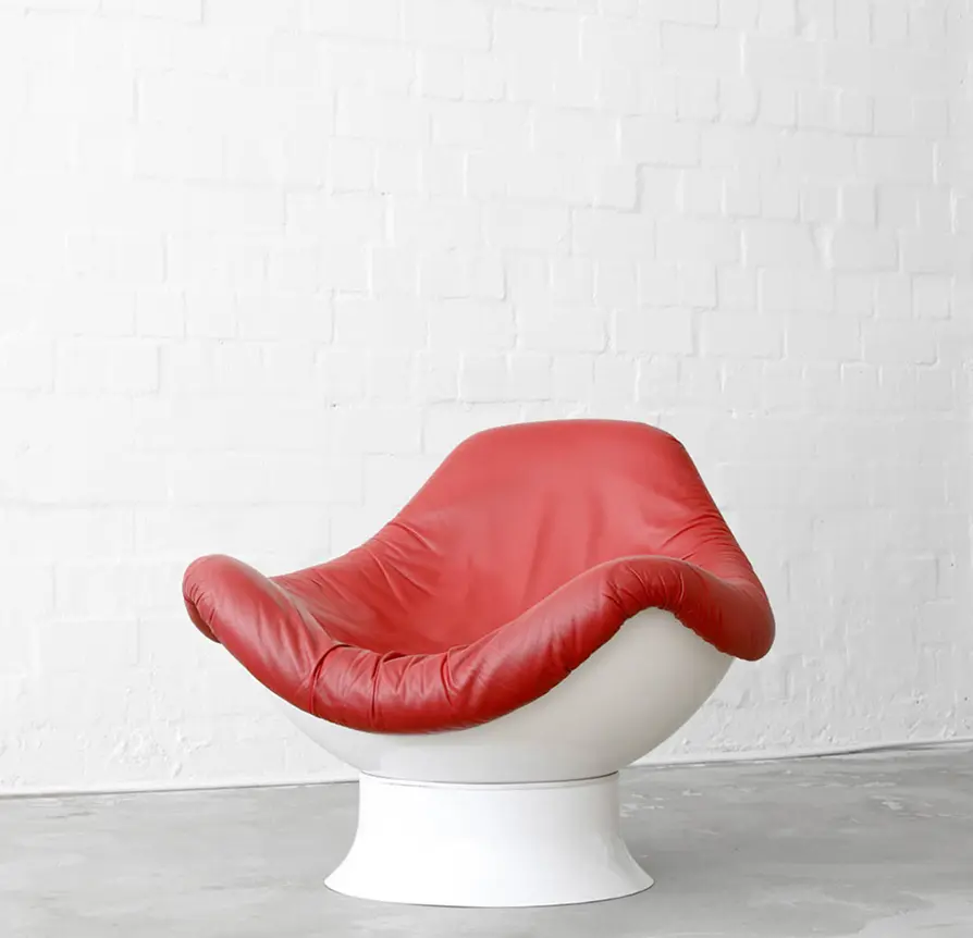 Mid-century modern lounge chair with red leather cushion and white base