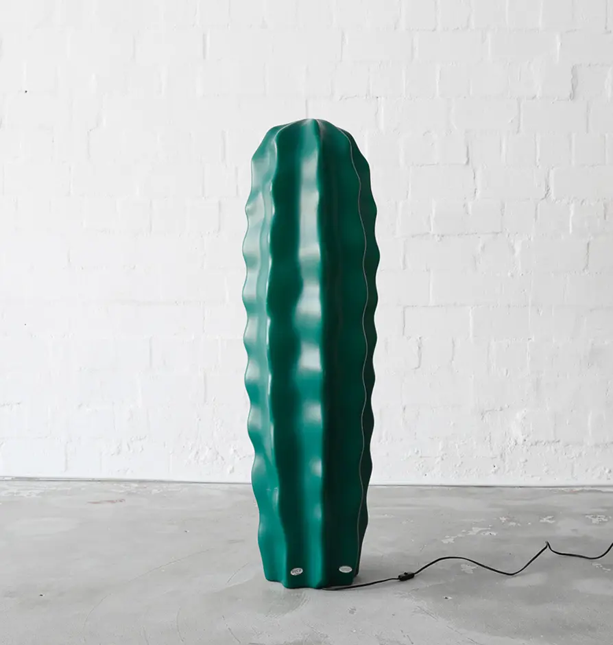Tall floor lamp shaped like a green cactus with wavy texture