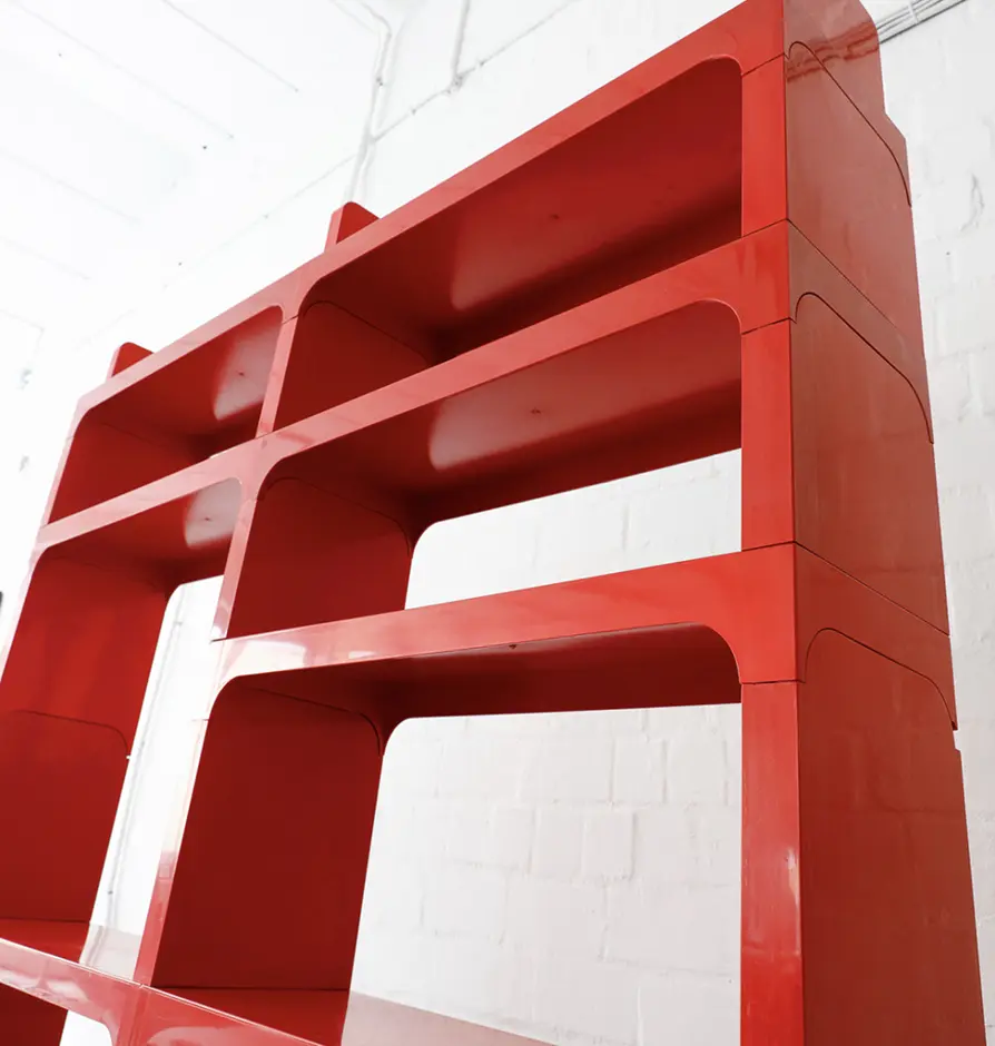 Glossy red modular shelving unit with curved edges