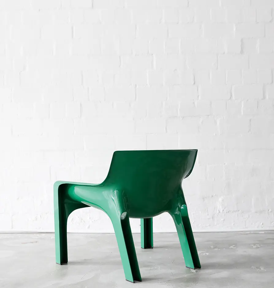 Back view of a green plastic chair with a modern design