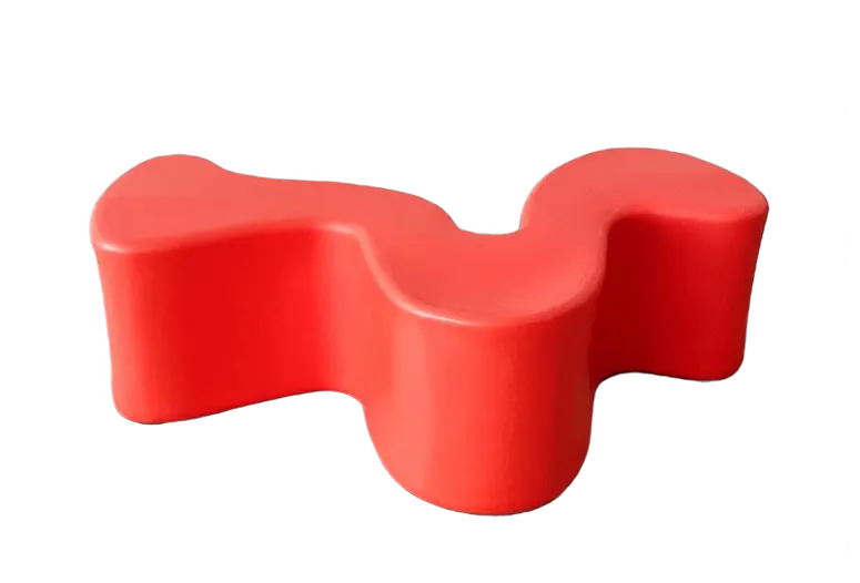 Bright red wavy bench with an abstract, playful form