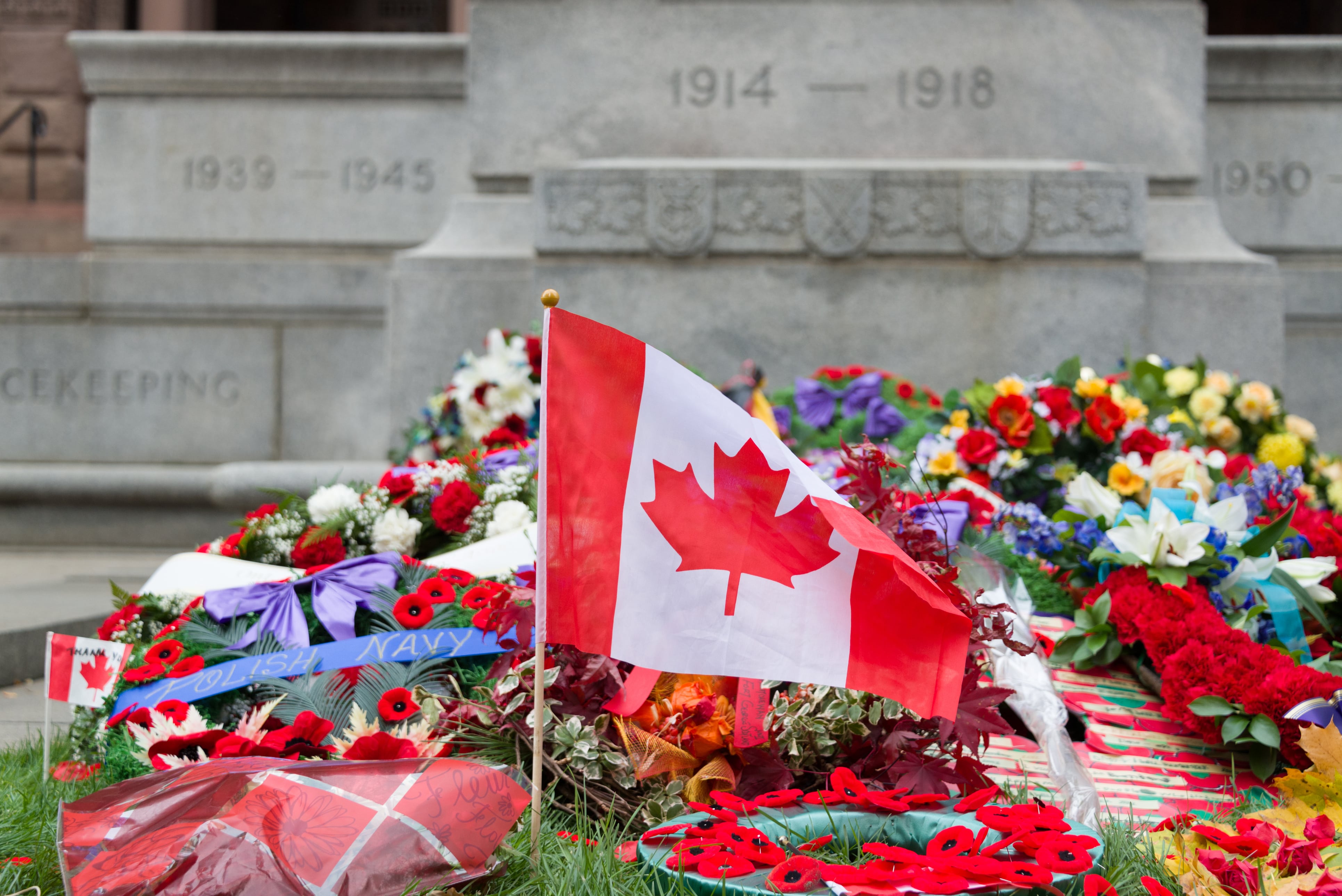 Canadian flag laid amongst wreaths