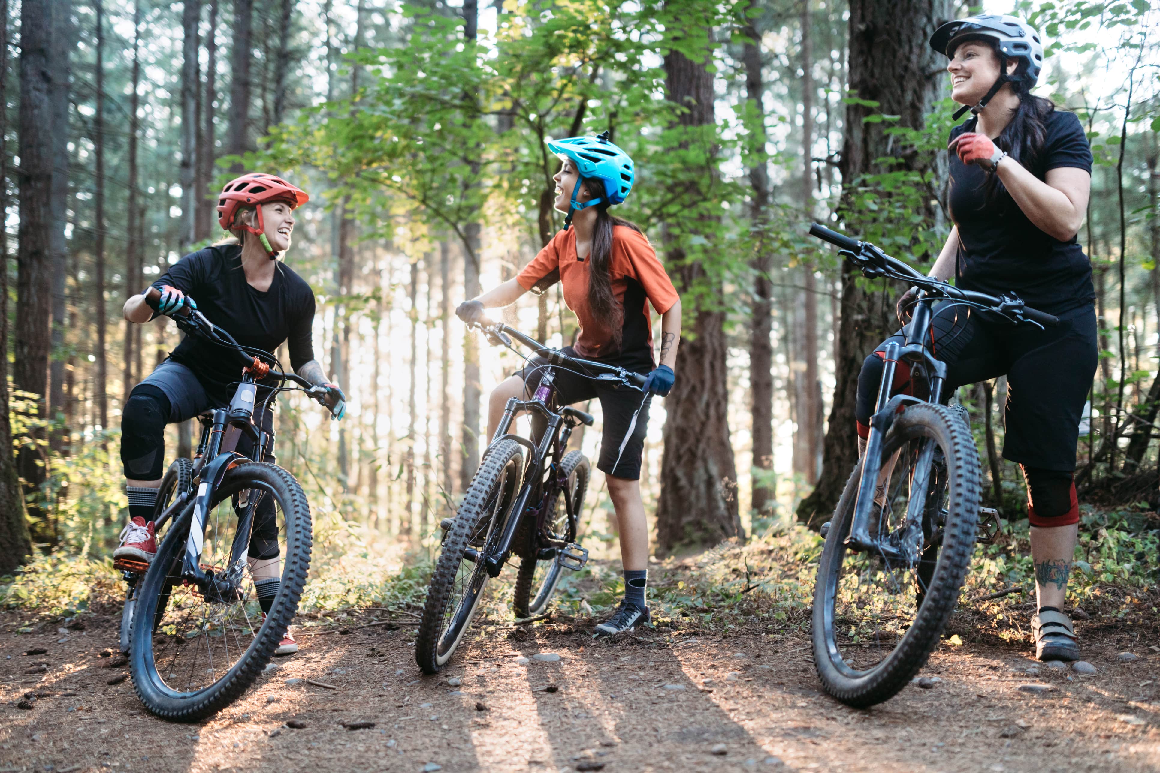 Women posing with mountain bikes