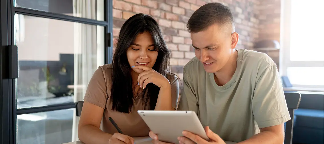 Couple reviewing a loan document on a tablet