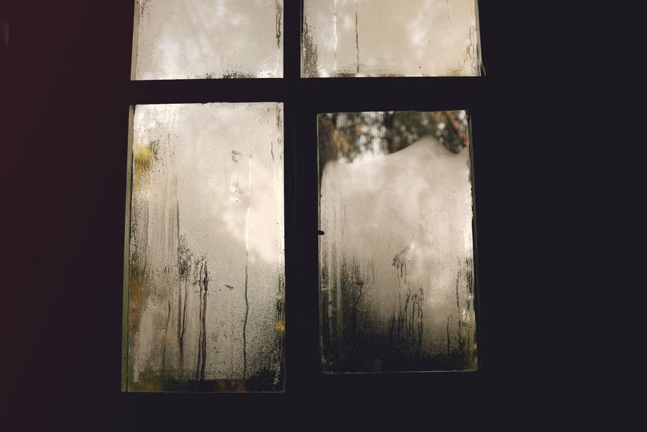 condensation on a window pane indicating high indoor humidity condensation on a window pane indicating high indoor humidity