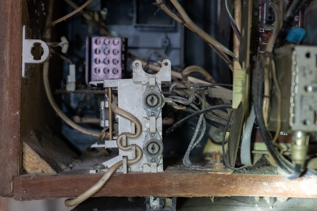A swollen and damaged AC capacitor that has failed due to heat stress A swollen and damaged AC capacitor that has failed due to heat stress