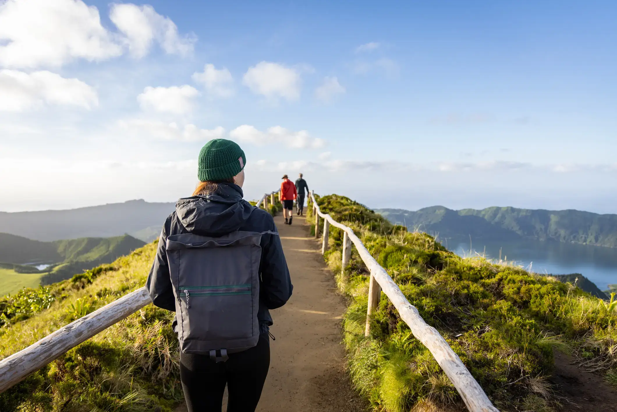 a group of people walking up a hill