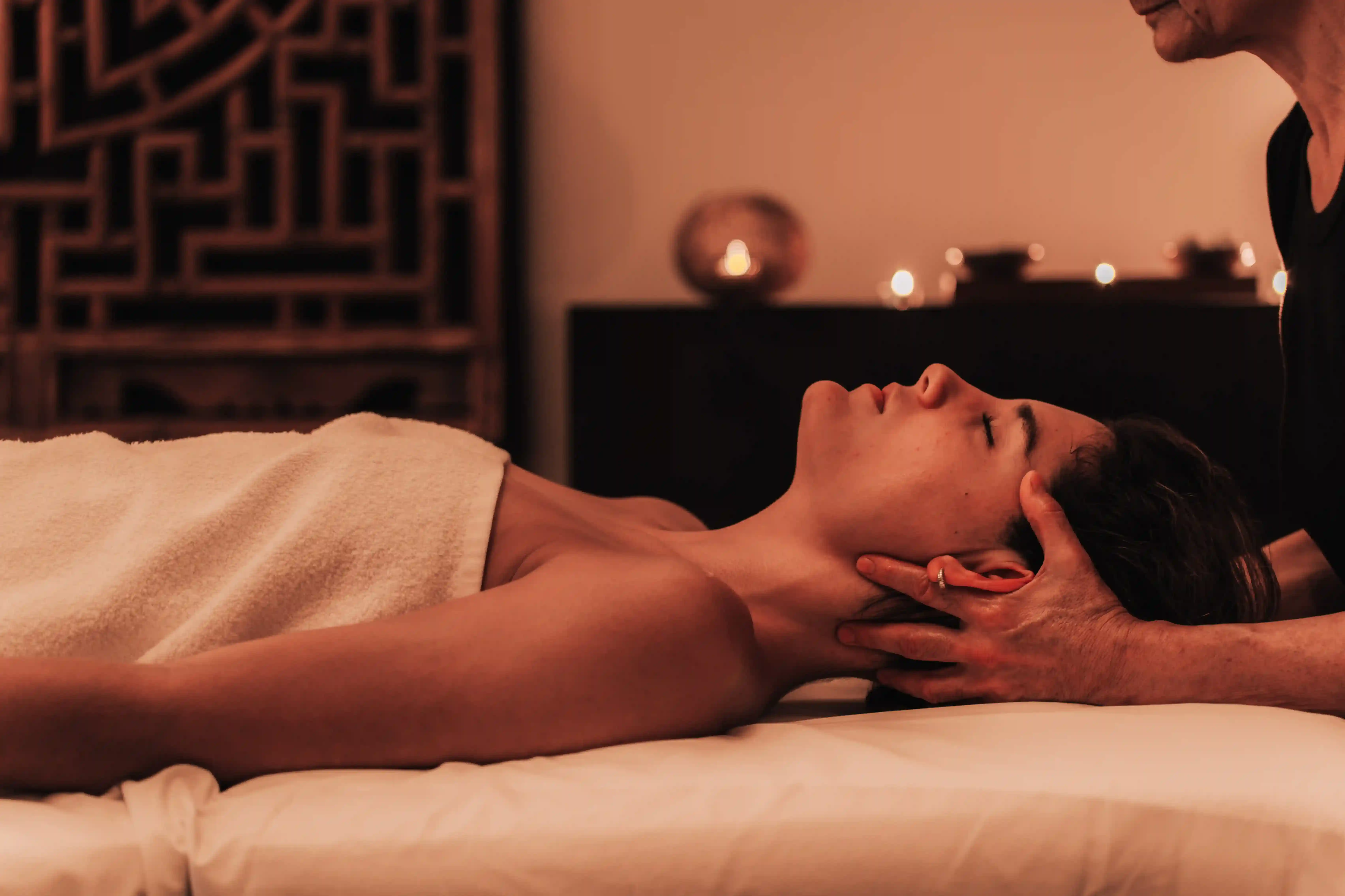 a woman getting a back massage at a spa