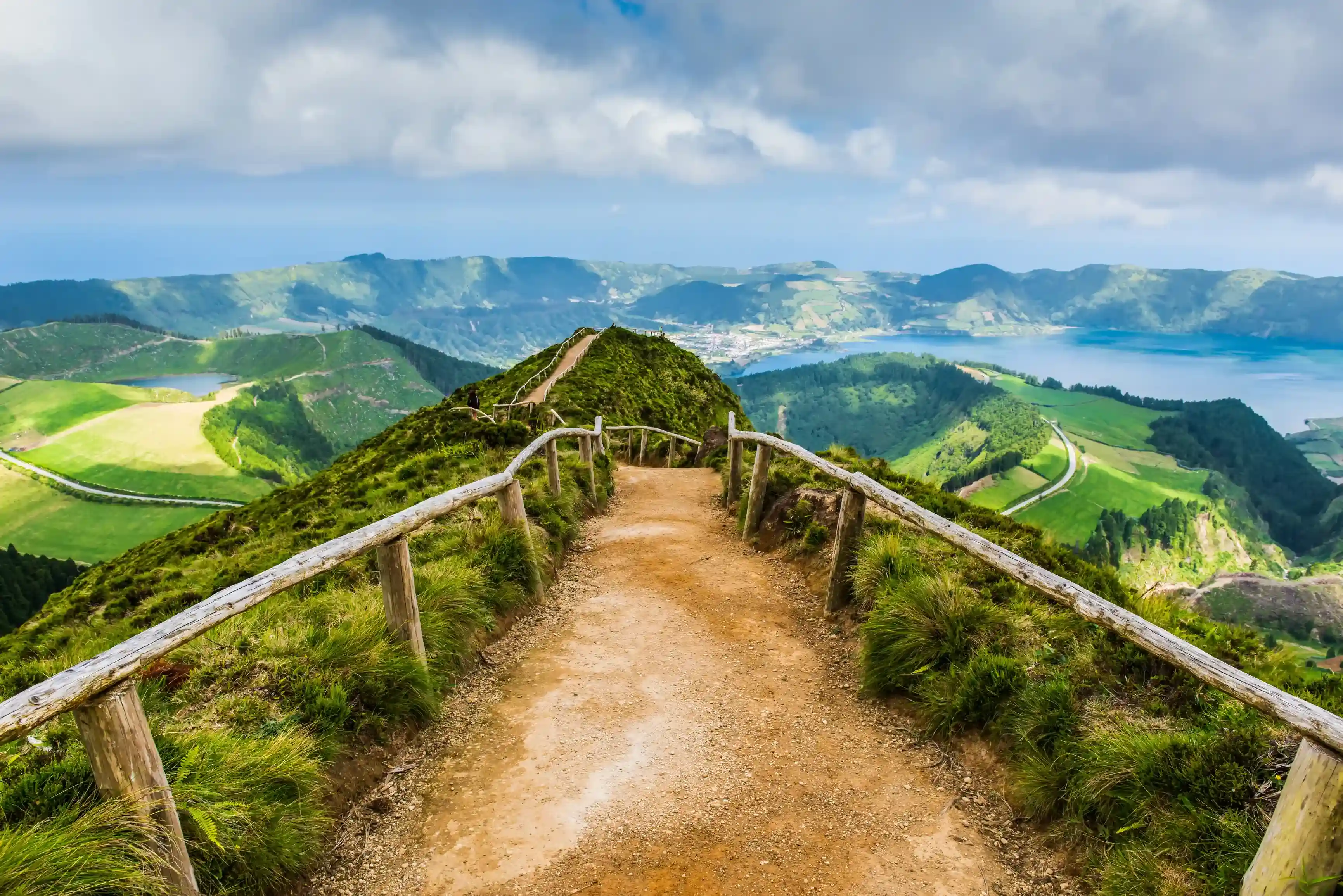 a dirt path leading to the top of a mountain