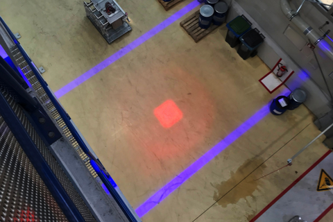 LED safety projector installed on overhead beam