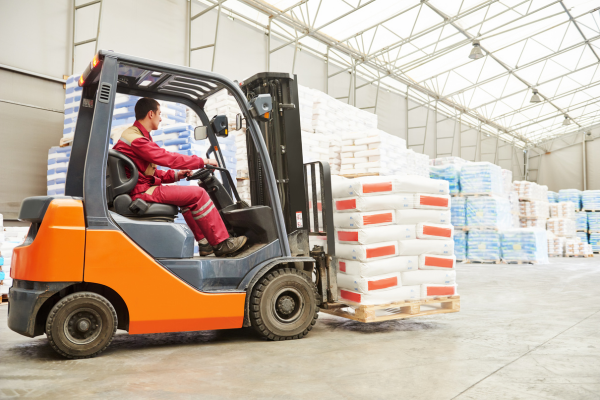 forklift driver transporting cement bags