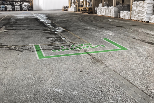 Clear projected bay markings for safe vehicle alignment at cement facility