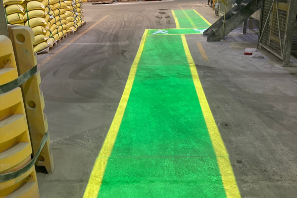Clear projected bay markings for safe vehicle alignment at cement facility