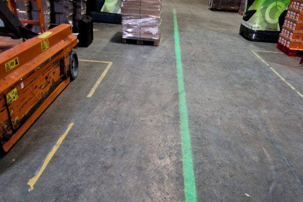 Green laser projected walkway lines in UK food manufacturing facility