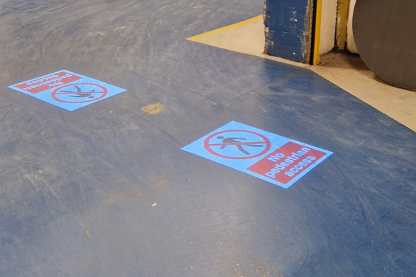 Dynamic floor markings guiding foot traffic at aerospace site