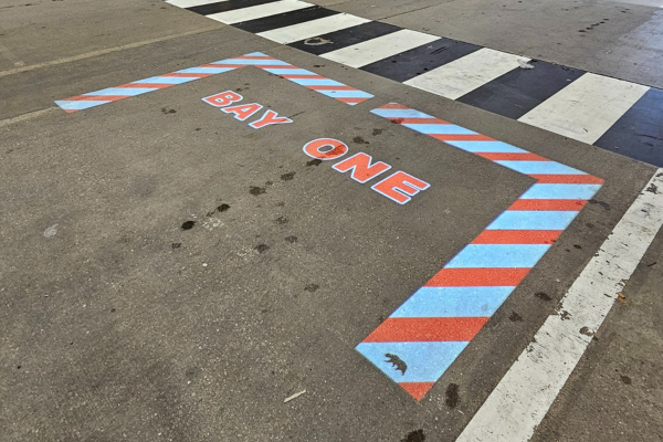 Projected 'Bay One' floor marking in aerospace loading zone