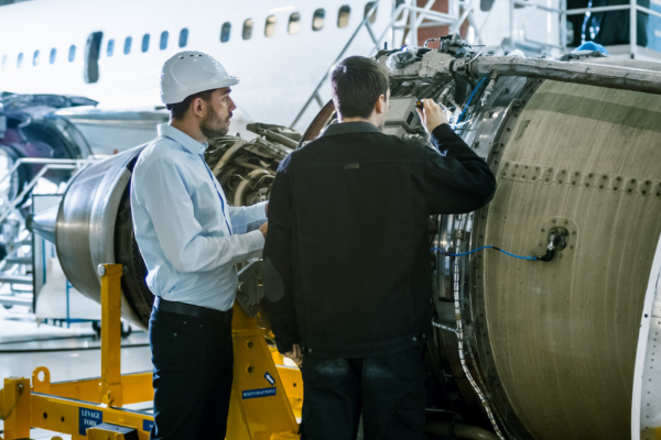 aerospace engine manufacturer workers discussing safety