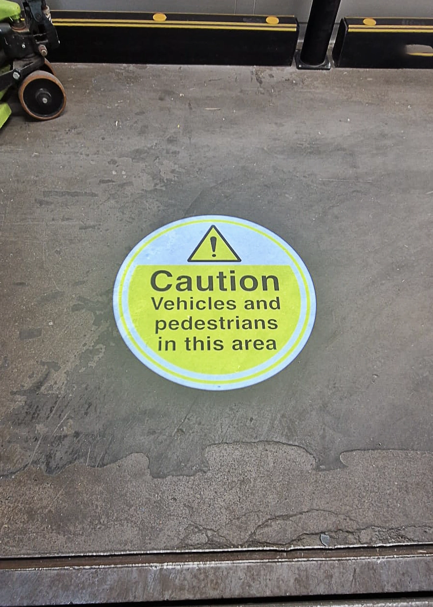 custom LED gobo says Caution Vehicles and Pedestrians in this area